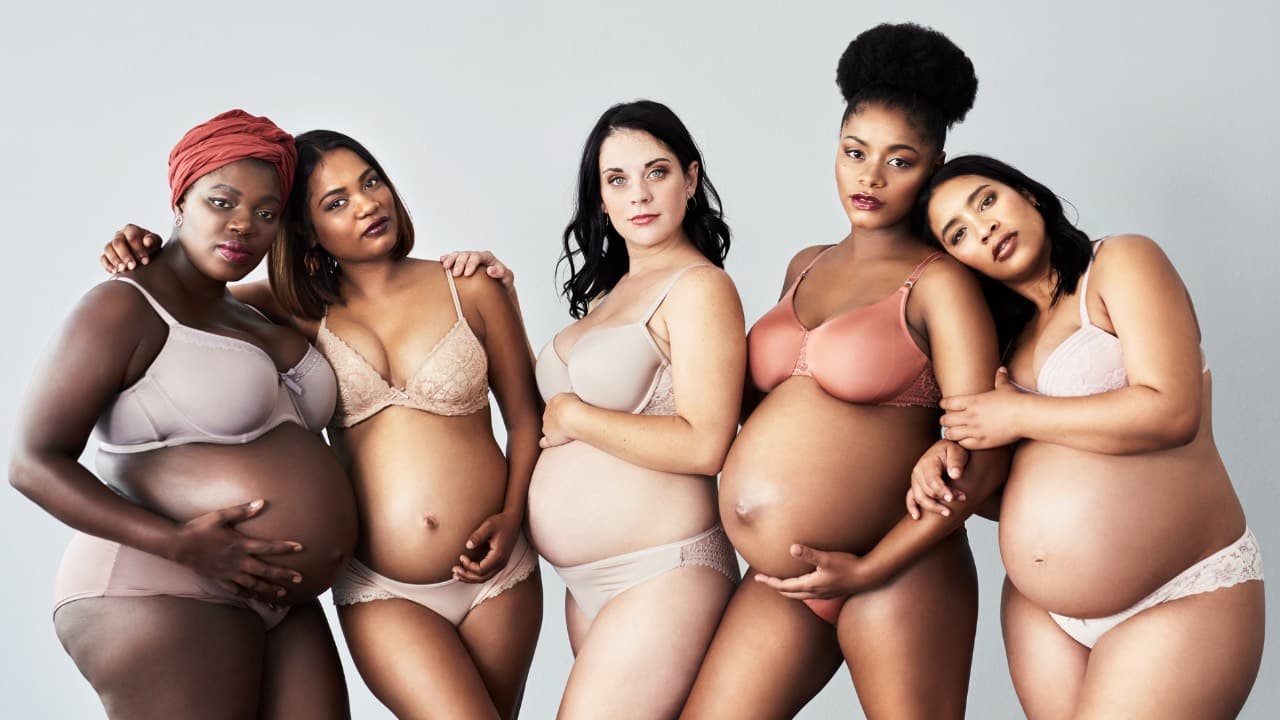A person meditating in beige clothing